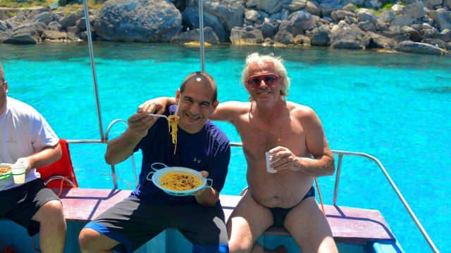Michael and Ivan - longtime friends enjoying some fun and pasta on the boat in Favignana, Sicily
